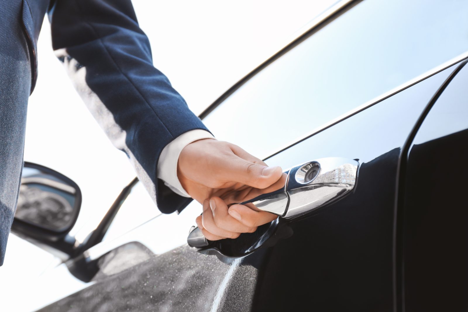 Midway Airport Chauffeur Car Door A chauffeur holding the car door open